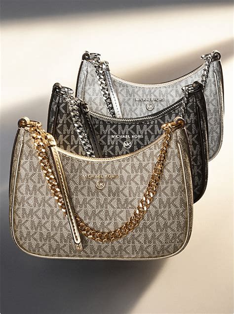 michael kors jet charmed pouch|Jet Set Charm Small Metallic Leather Pochette.